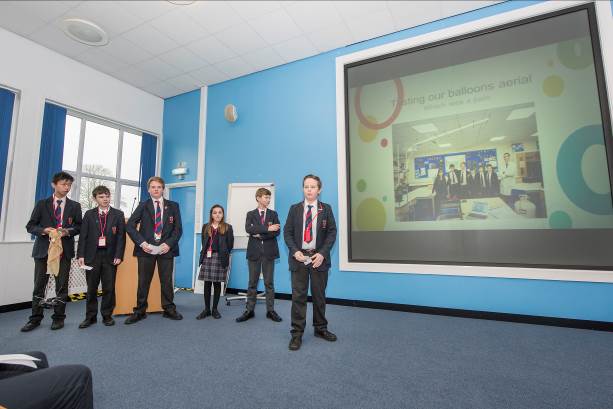 The team from Ryde School with Upper Chine describe pre-launch testing to the Prize Day audience at MOD Boscombe Down.